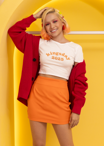 Bella canvas crop top mockup featuring a cheerful woman in a colorful pop wave setting m38790